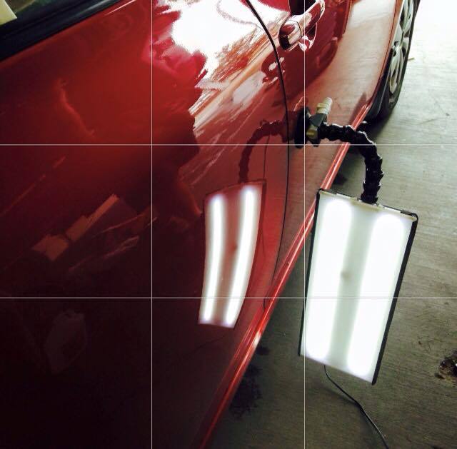 a red car with a light attached to it