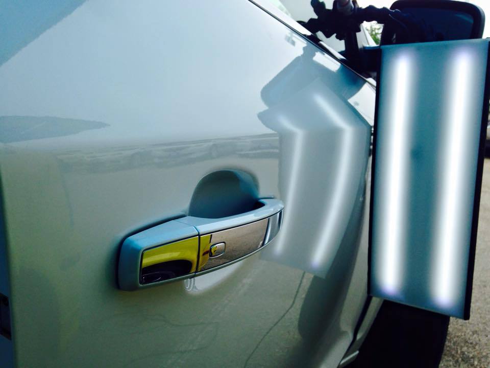 a close up of a car door with a handle