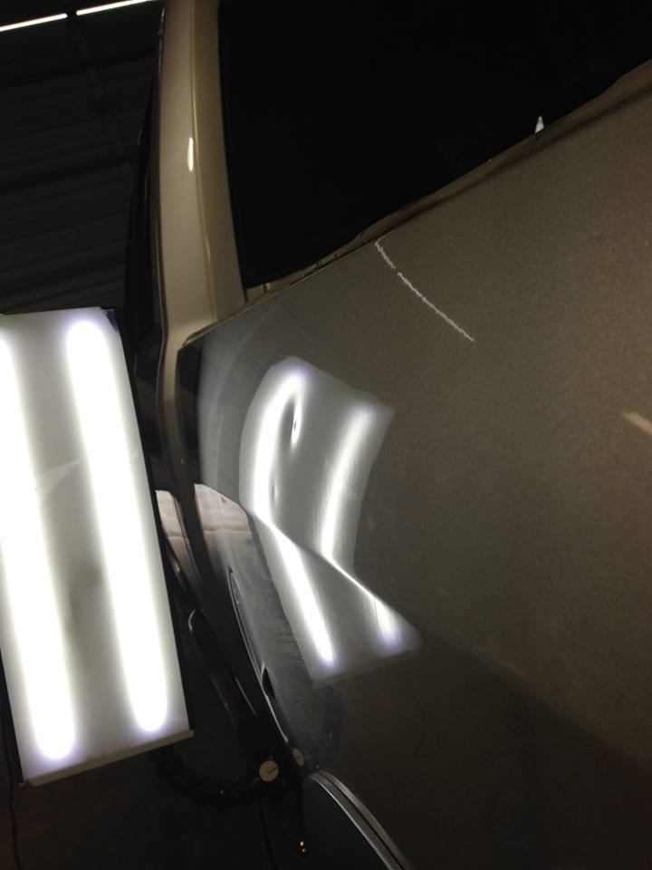 a close up of a car with a light shining on it
