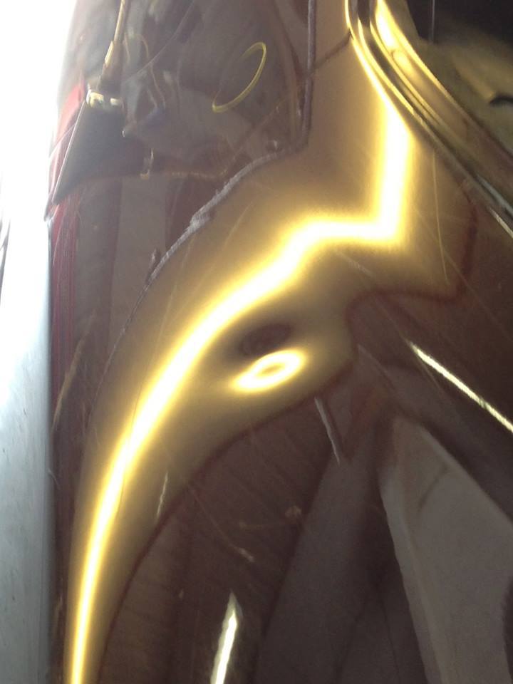 a close up of a car with a yellow spot on it