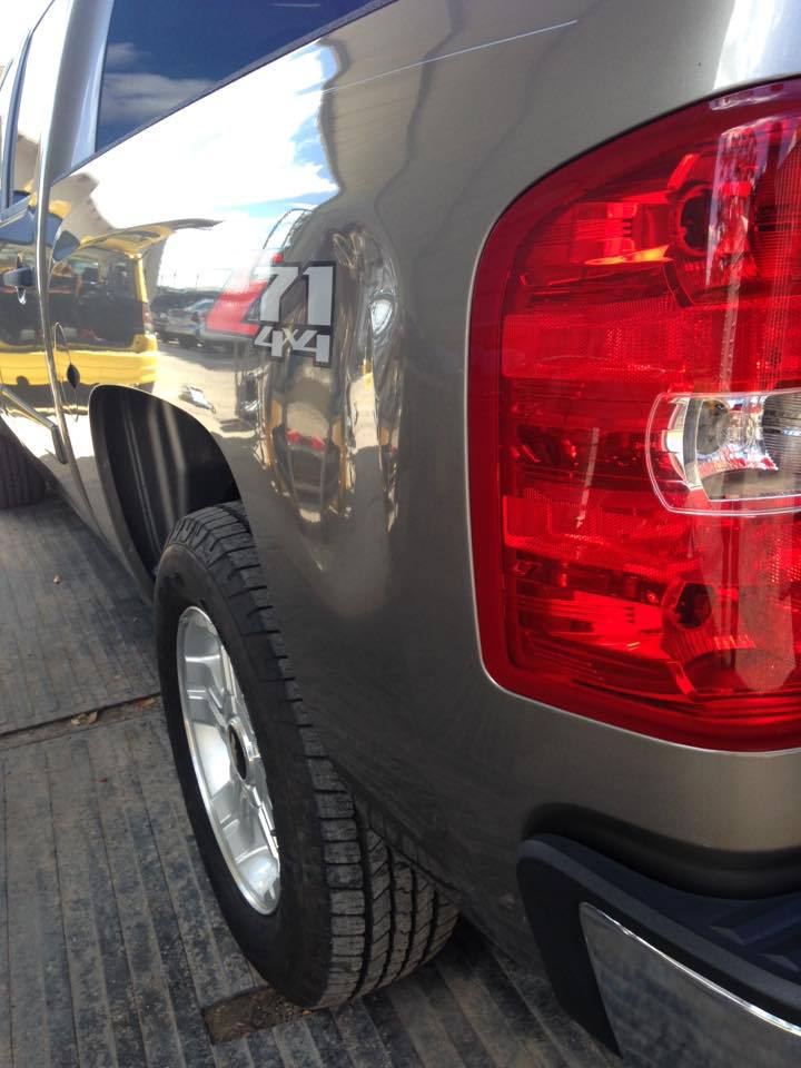 a silver truck with the word 4x4 on the side