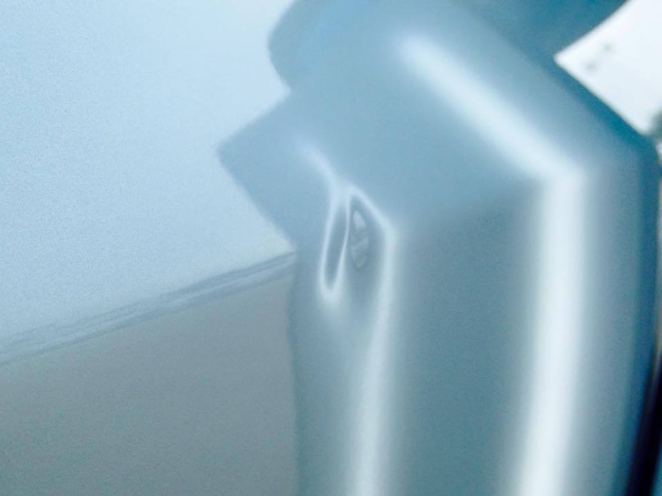 a close up of car dent