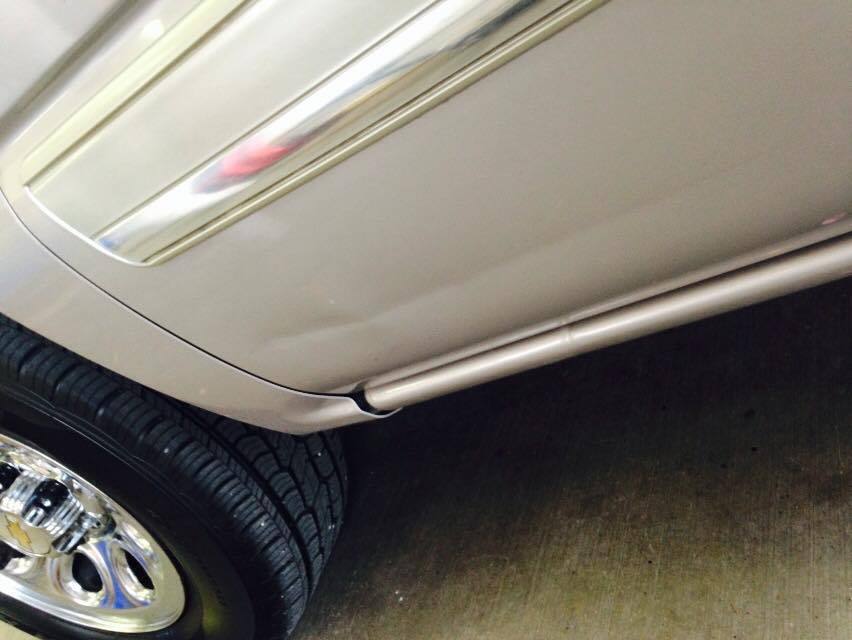 a close up of a car 's side and tire