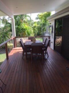 Wooden verandah with table and chairs