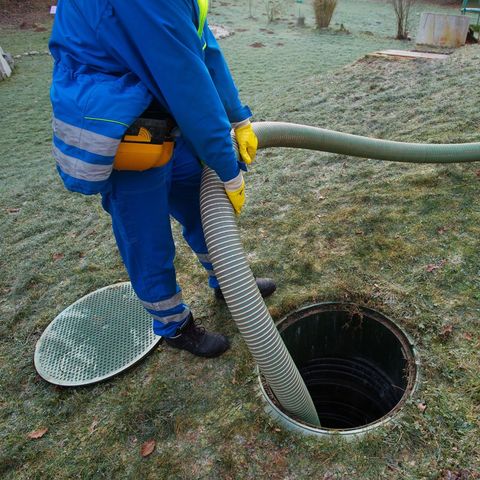 Man Draining Septic Tank — Sacramento, CA — Lamar A1 – Septic Services Inc.