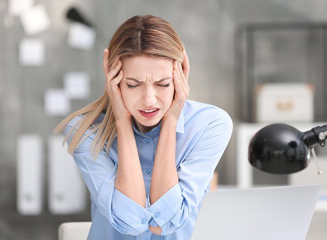 young woman suffering from headache