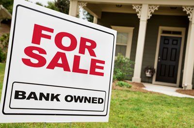 For Sale sign in front of home