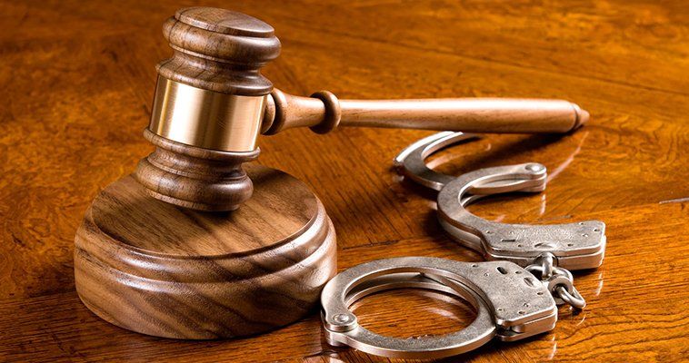 Hammer, gavel and set of handcuffs