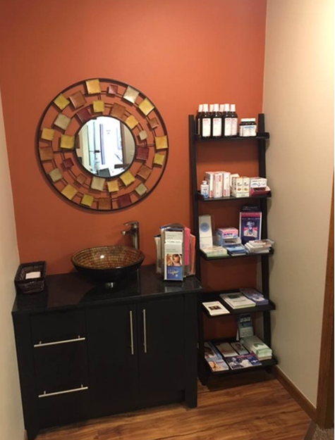 View of a cabinet and shelves with dental reference resources