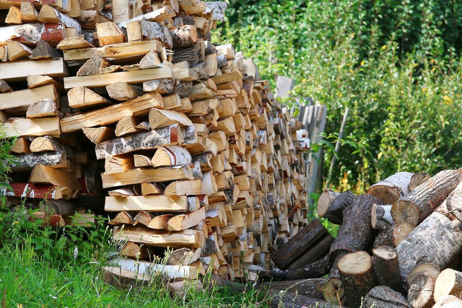 A pile of logs is stacked on top of each other for Denver Firewood Delivery