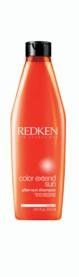 A bottle of redken conditioner on a white background.