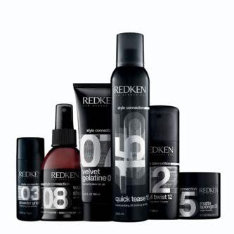 A group of redken hair products are sitting next to each other on a white background.