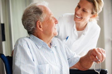 Elderly man with women nurse