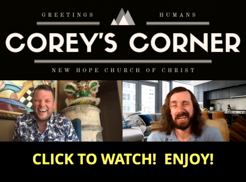 Two men are sitting in front of a sign that says corey 's corner