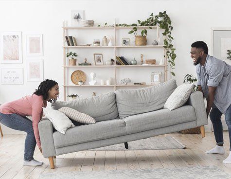 Couple Moving the Sofa — Shelbyville, TN — Kincaid Moving & Storage