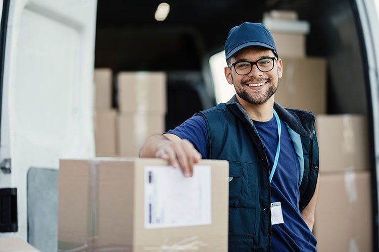 Man Holding a Box — Shelbyville, TN — Kincaid Moving & Storage