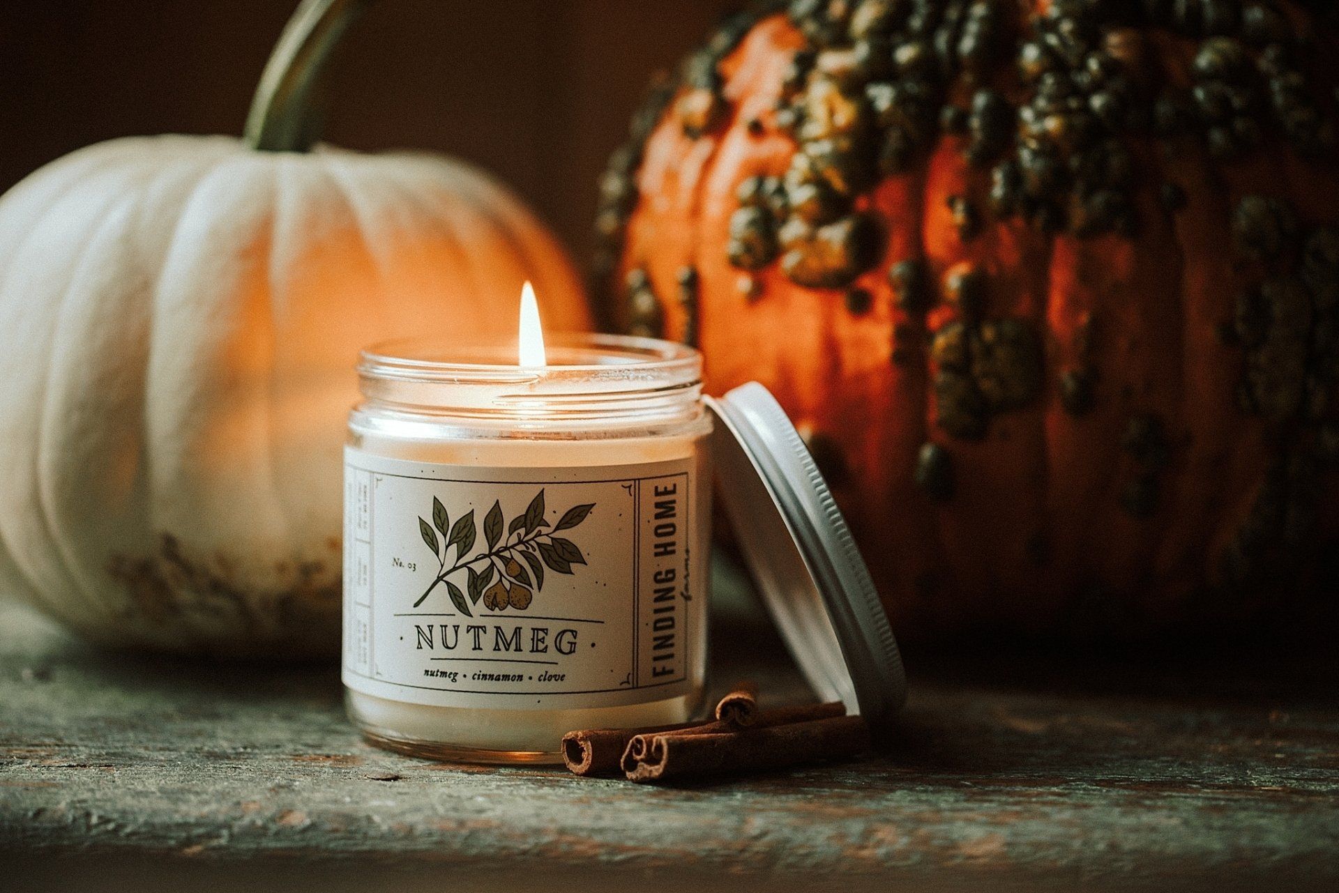 Lit candle in a jar with