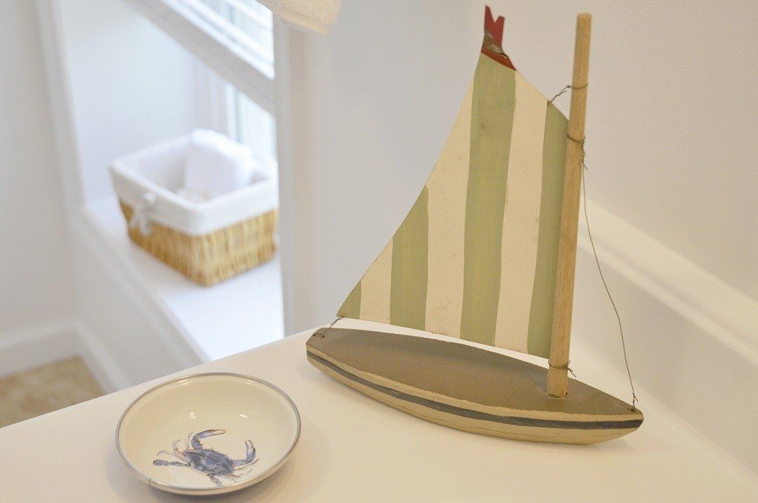 Bathroom sink and vanity with soap dish and nautical decorations
