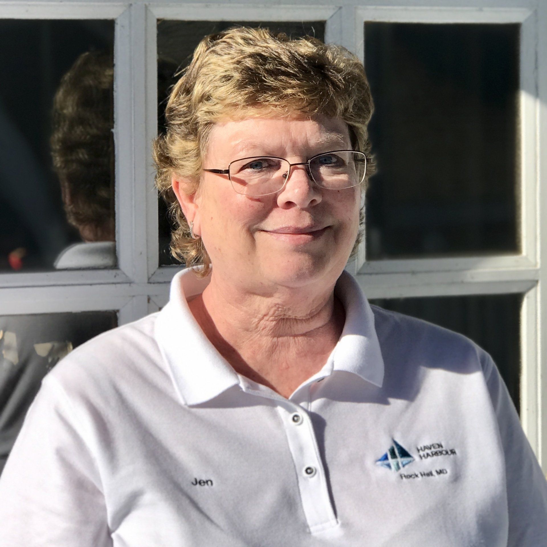 Photo of staff member face in front of window