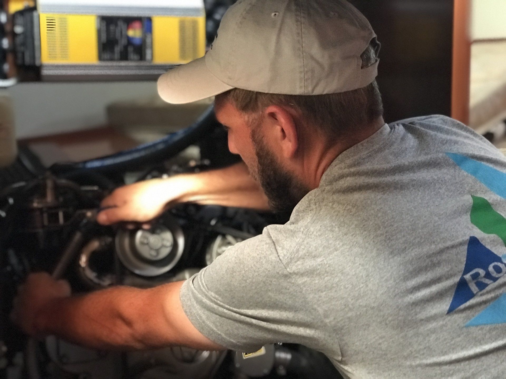 Mechanic working in engine room of a boat