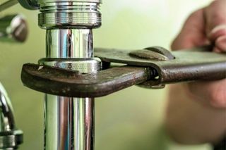 Plumber at work — Plumbing and Heating Services in Kirkwood, NJ Plumber at work — Plumbing and Heating Services in Kirkwood, NJ