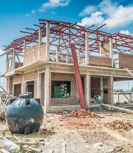 Septic Tank Repair — Septic Tank Besides Construction Site in Normal, IL Septic Tank Repair — Septic Tank Besides Construction Site in Normal, IL