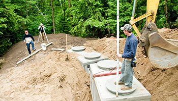 Workers Inspecting Septic Site — Pembroke, GA — Huggins Waste Services Workers Inspecting Septic Site — Pembroke, GA — Huggins Waste Services
