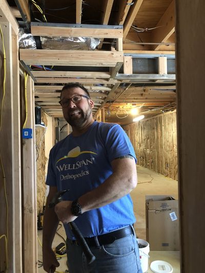 Worker Fixing Outlet — Seven Valleys, PA — Smeltzer Electrical Service, LLC. Worker Fixing Outlet — Seven Valleys, PA — Smeltzer Electrical Service, LLC.