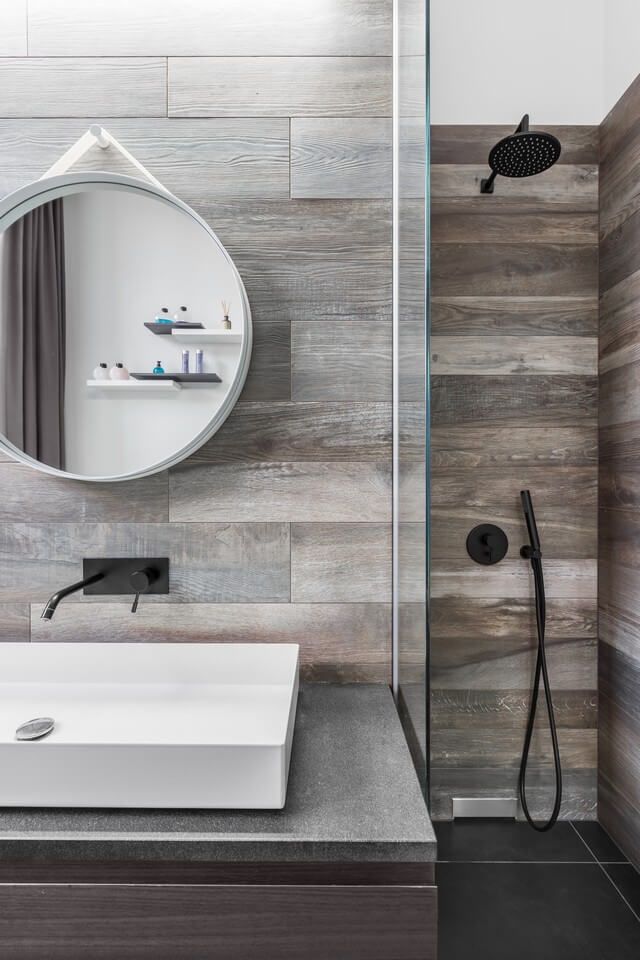 modern bathroom with round mirror