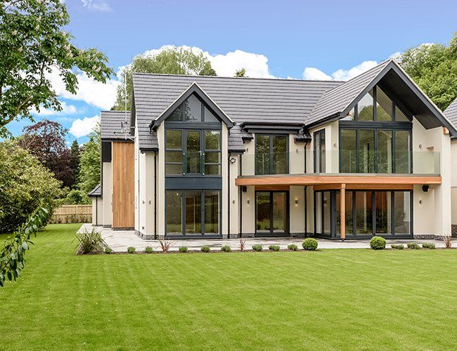 big house with green grass field