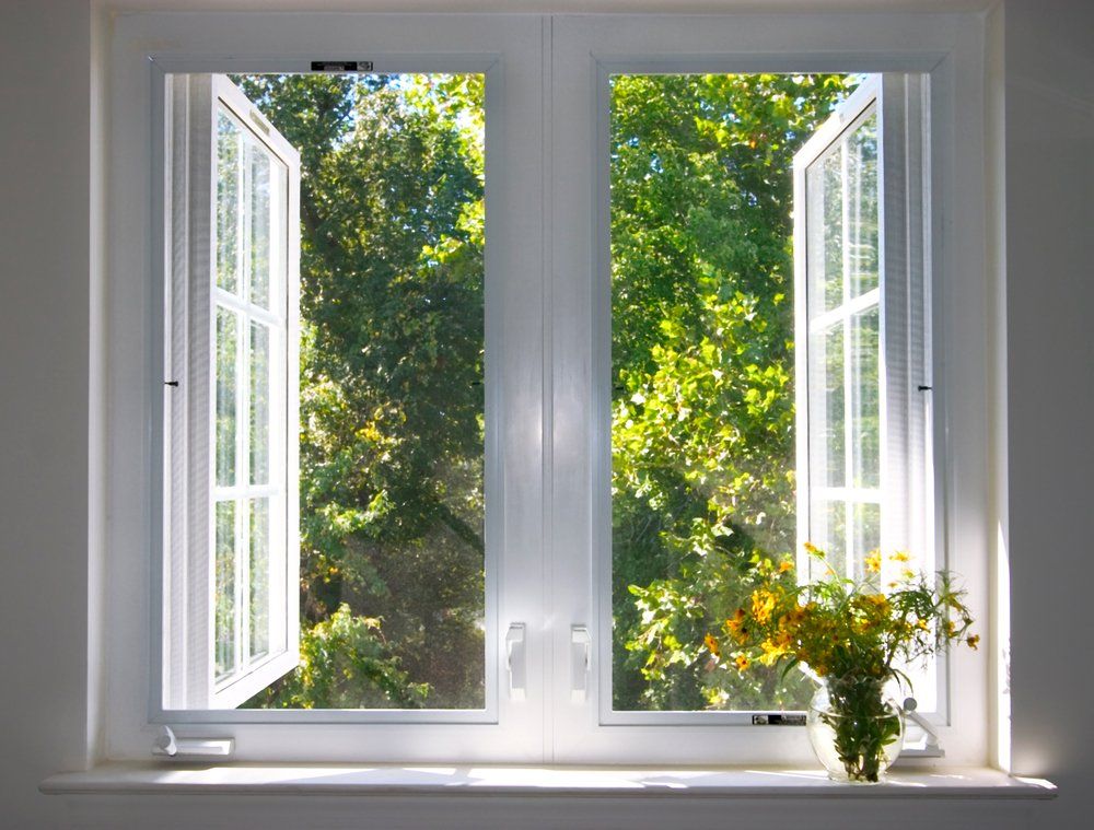 Opened Window With Flowers — Peru, IN — Hack’s Construction and Window Co. Opened Window With Flowers — Peru, IN — Hack’s Construction and Window Co.