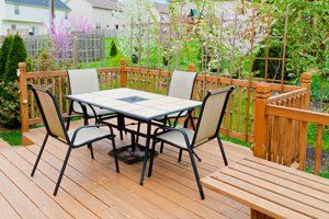 decked dining area above garden
