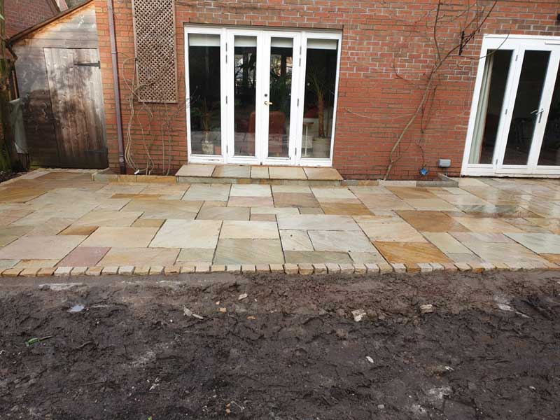 view down gharden of sandstone slab patio