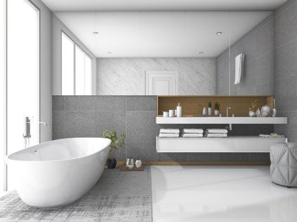 bathroom with mirror and tub