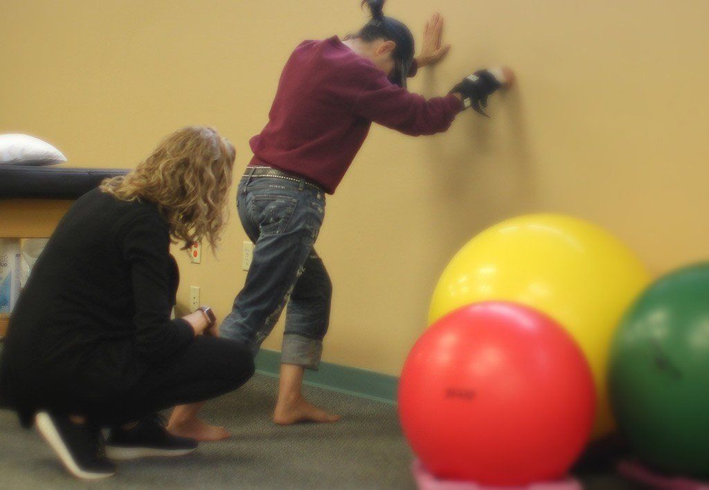physical therapist teaches client picture