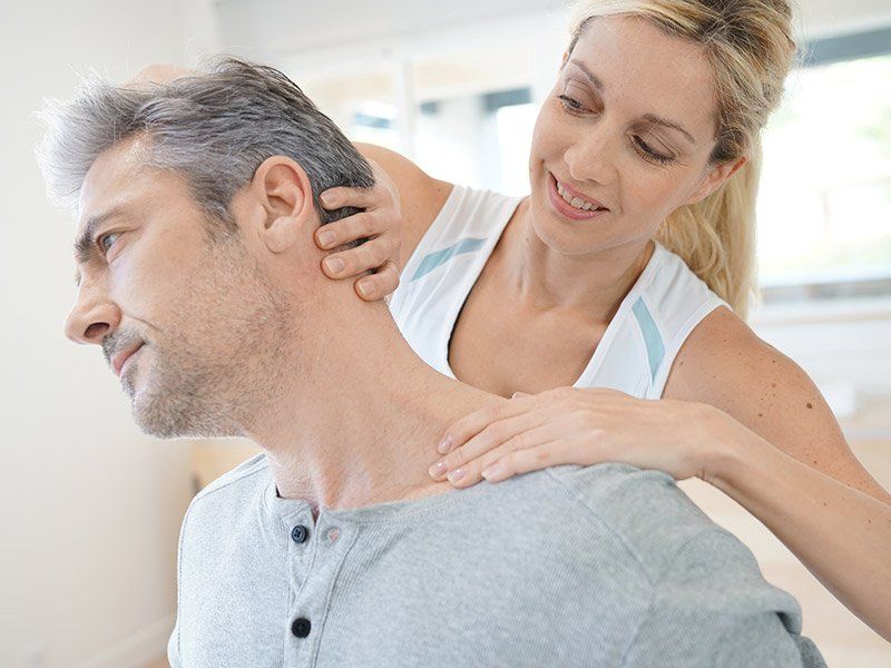 physical-therapist-working-on-neck-pain