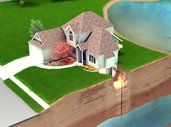 An aerial view of a house next to a body of water.