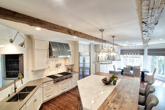 There is a large island in the middle of the kitchen.