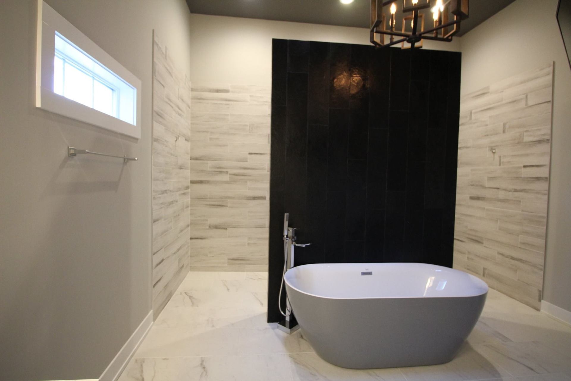 There is a bathtub in the middle of the bathroom.
