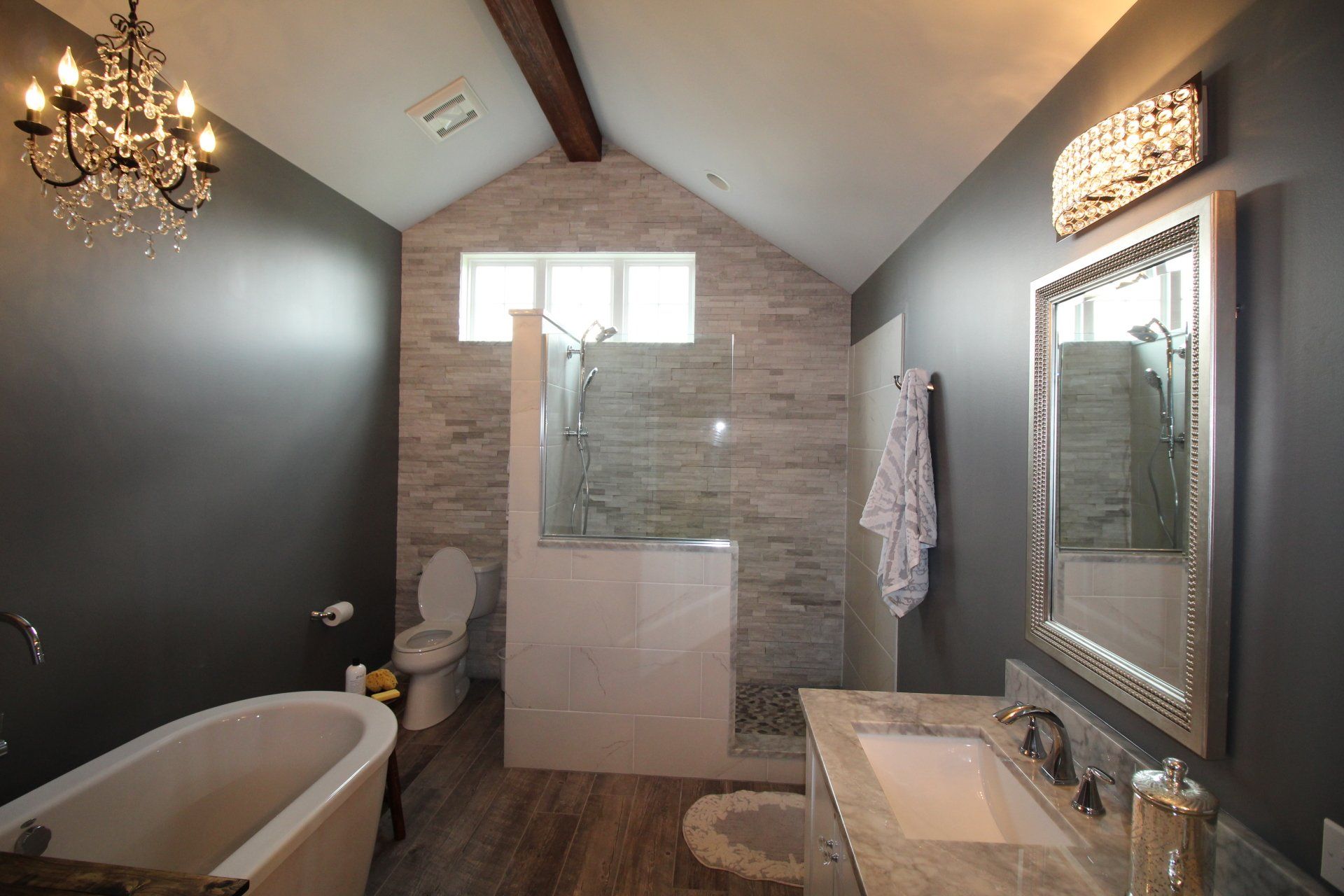 A bathroom with a bathtub a sink and a toilet