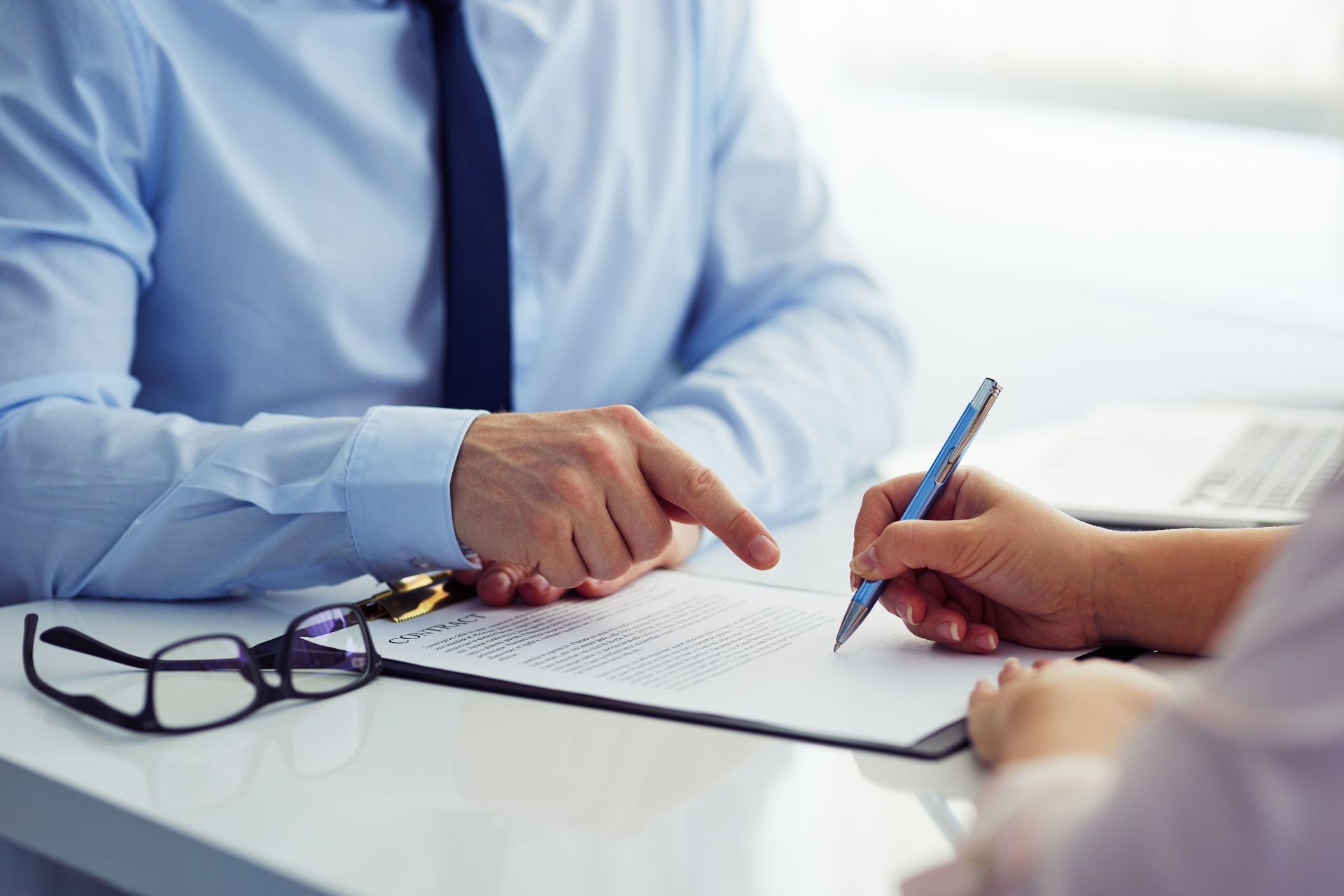 People doing paperwork at a desk