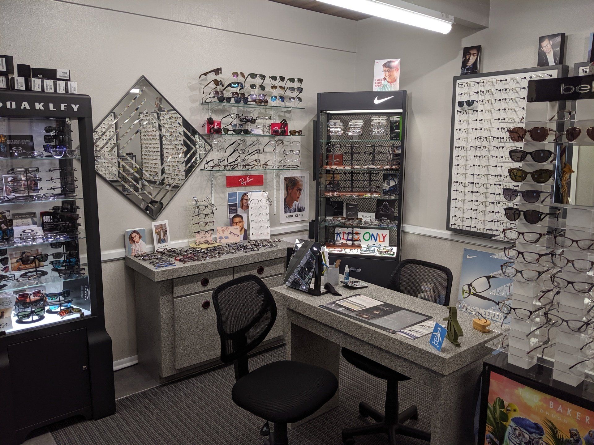Eyeglass rack with mirror — Vision Exams In Colorado, CO Eyeglass rack with mirror — Vision Exams In Colorado, CO