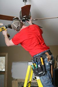 LED Lighting — Electrician fixing chandelier  in Chino Hills, CA
