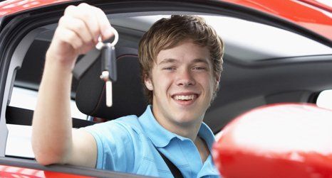 A boy holding car key