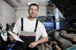 mechanic in body repair shop