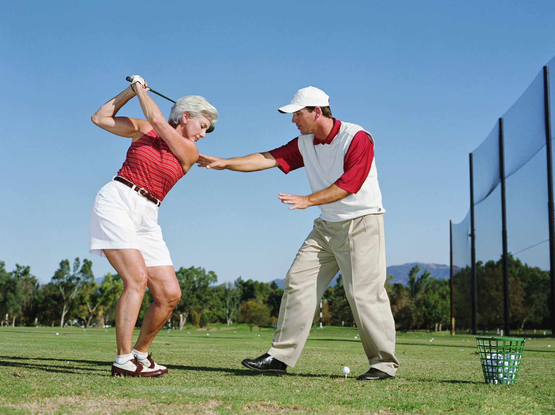 People playing golf in the field — Golf Lessons in Hanover Park, Illinois People playing golf in the field — Golf Lessons in Hanover Park, Illinois