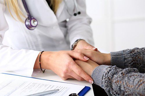 Doctor Holding Patient Hand