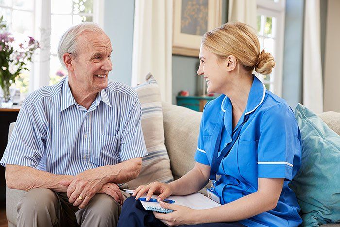 old man with a female caregiver