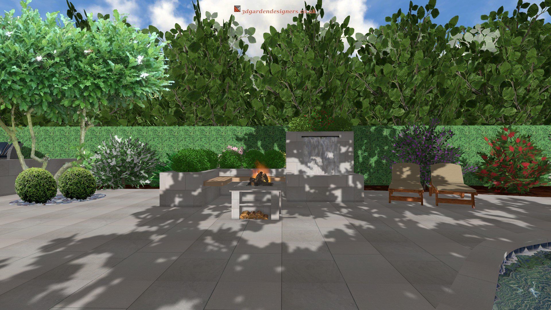Outdoor patio with fireplace, seating, and lush greenery. Gray stone, blue sky.