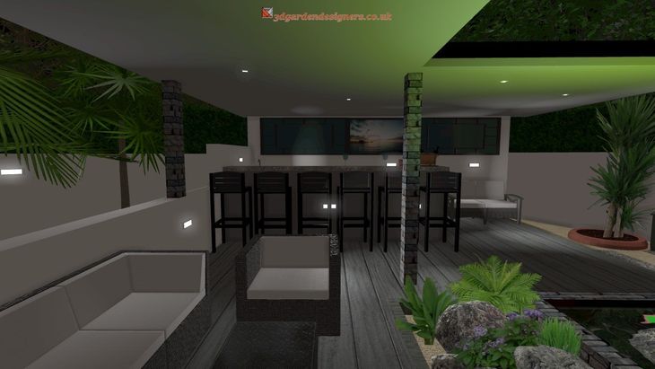 Outdoor lounge with bar, seating, and lush greenery lit with green and white lights.